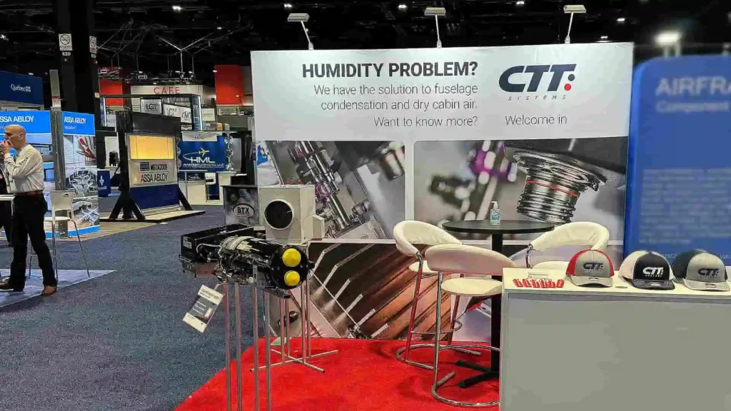 Custom-designed event booth with large-format graphics and messaging – exhibition design by Magnus Attefall